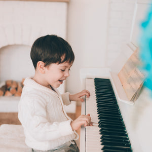 4 BENEFITS OF TEACHING YOUR CHILD TO PLAY THE PIANO